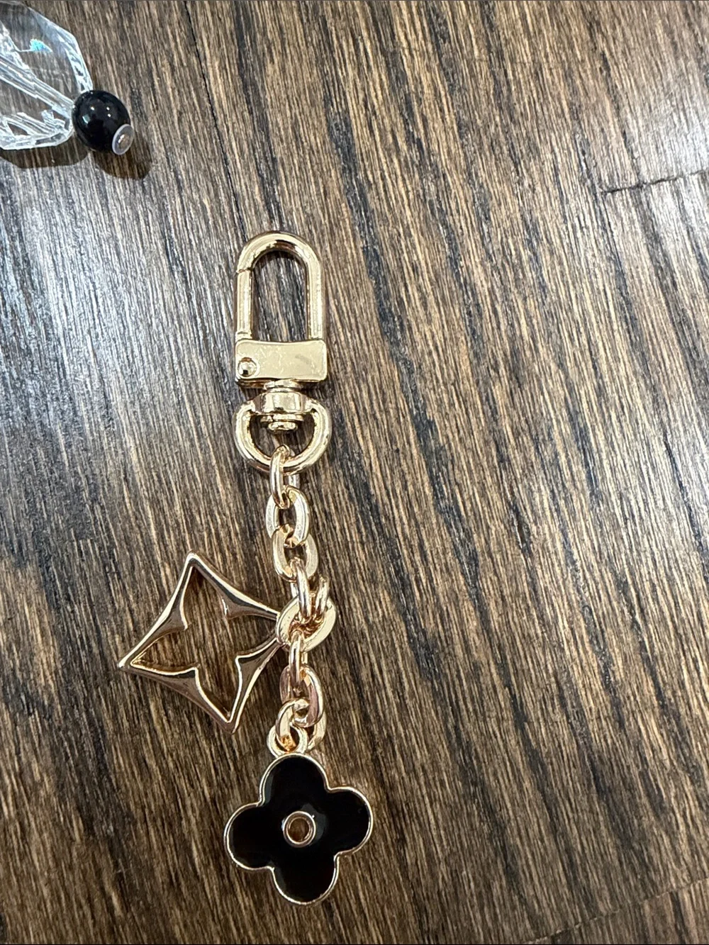 Set of 2 bag charms- Gold and Black Charm Keychain with Star & Flower Accents